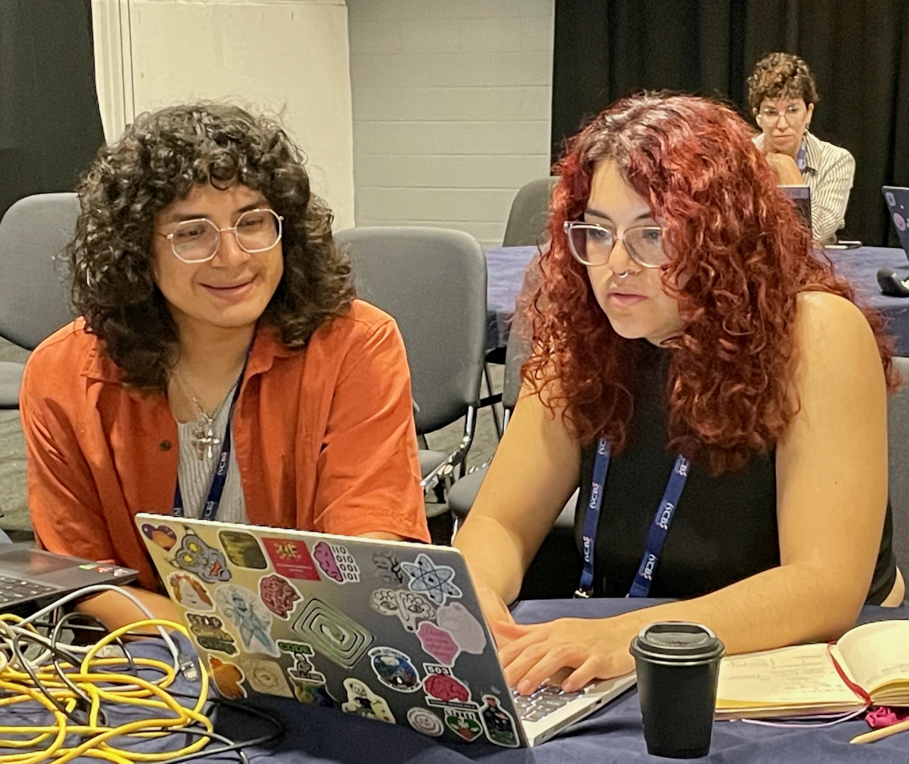 FAIR Data Innovations Hub team members working at ISMB 2025